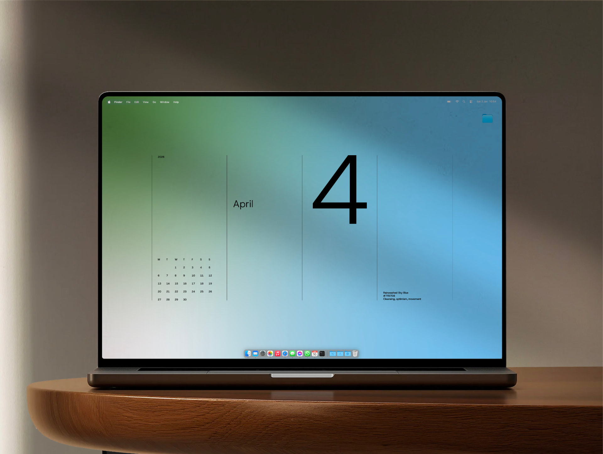 The April wallpaper on a MacBook Pro, with the large numeral 4 and the mini calendar